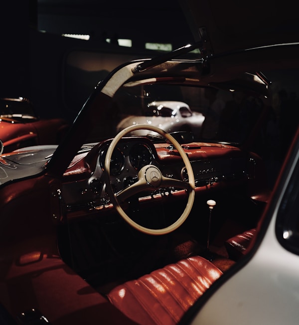 Car interior showing the driver seat and dashboard controls
