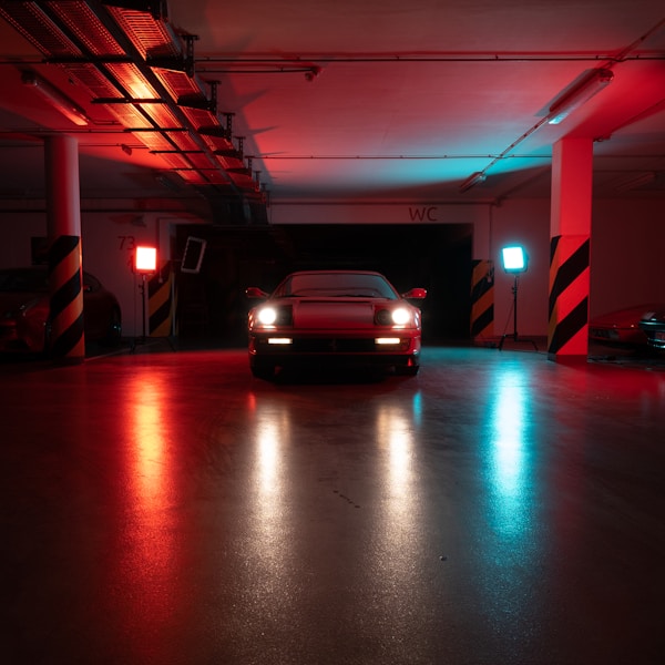 Car parked alone in a dimly lit garage